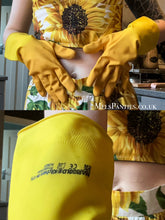 Load image into Gallery viewer, MelKimNylon wearing her used yellow marigold rubber gloves