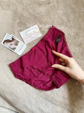 Load image into Gallery viewer, A pair of burgundy worn cotton panties