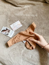 Load image into Gallery viewer, A beige worn used thong