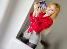Load image into Gallery viewer, Melkimnylon in a red shirt with grey shorts and some black used tights