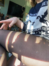 Load image into Gallery viewer, Melkimnylon thighs in some nylon black tights with a small hole
