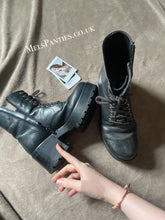 Load image into Gallery viewer, A pair of heavily worn leather boots that have split at sole